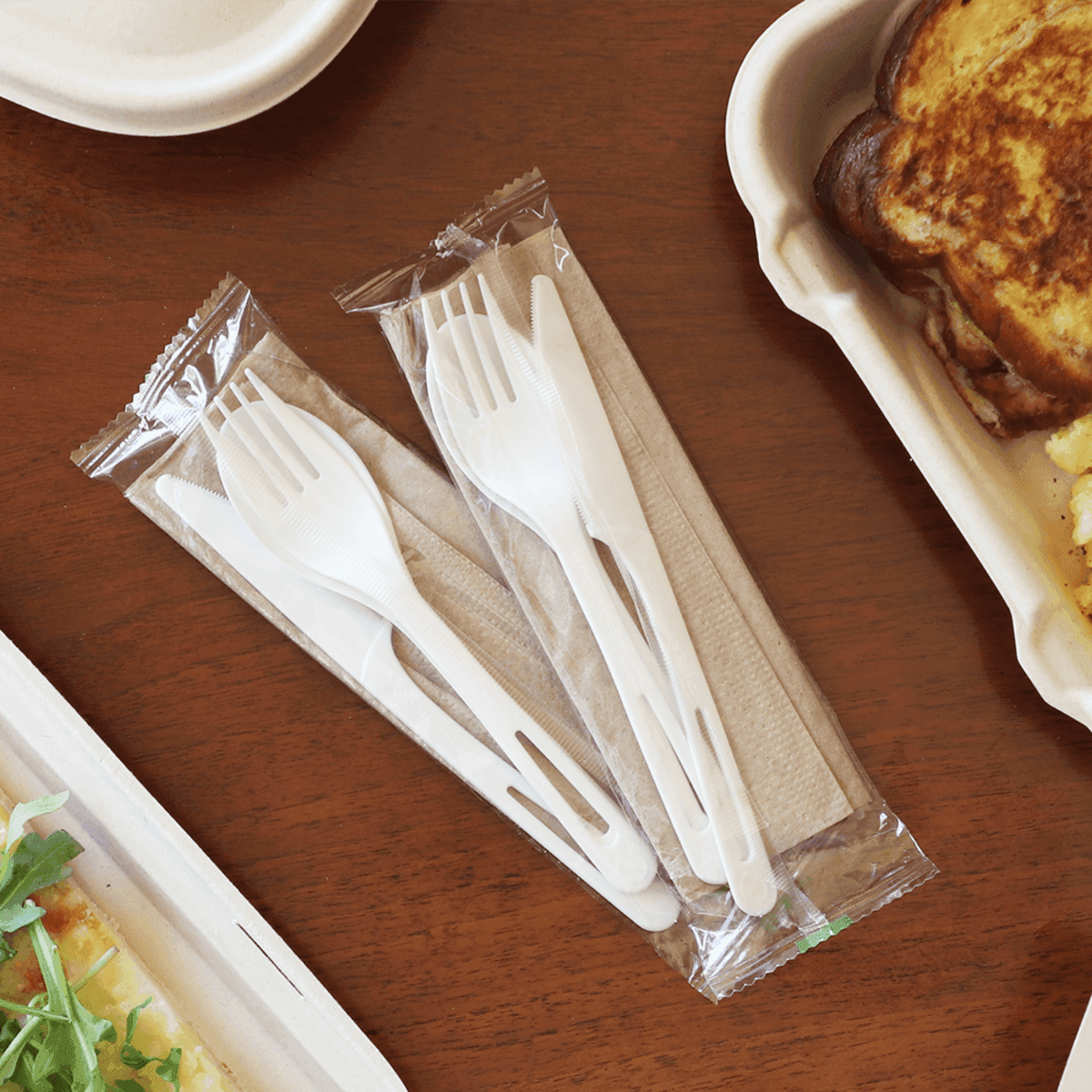 compostable fork, knife and spoon bundle near food