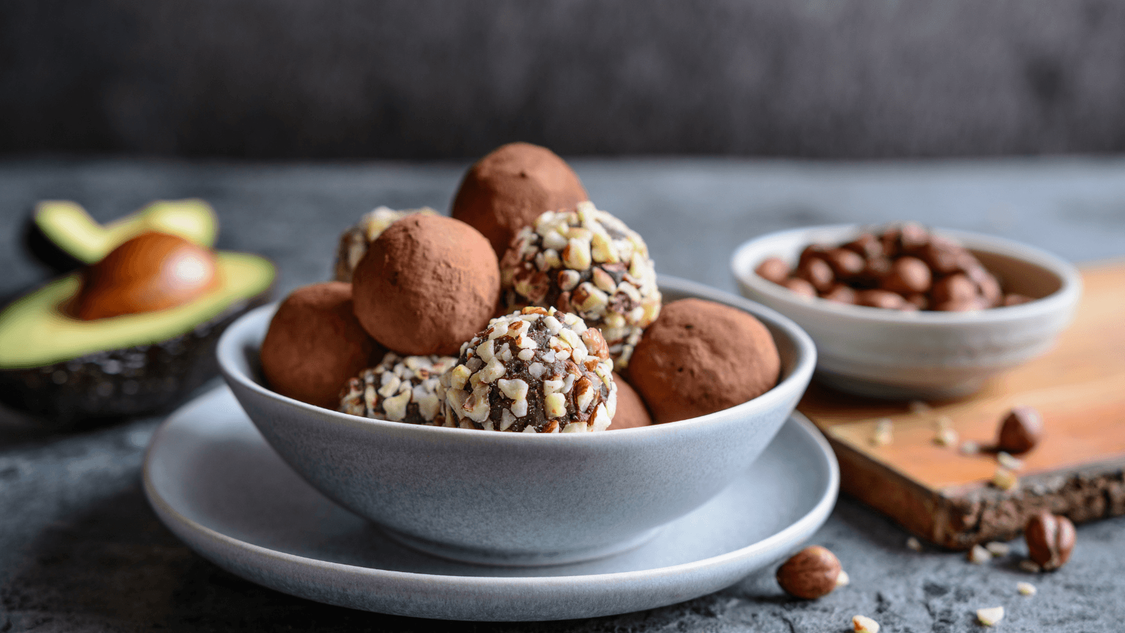 Chocolate avocado truffles with chopped hazelnuts and cocoa powder