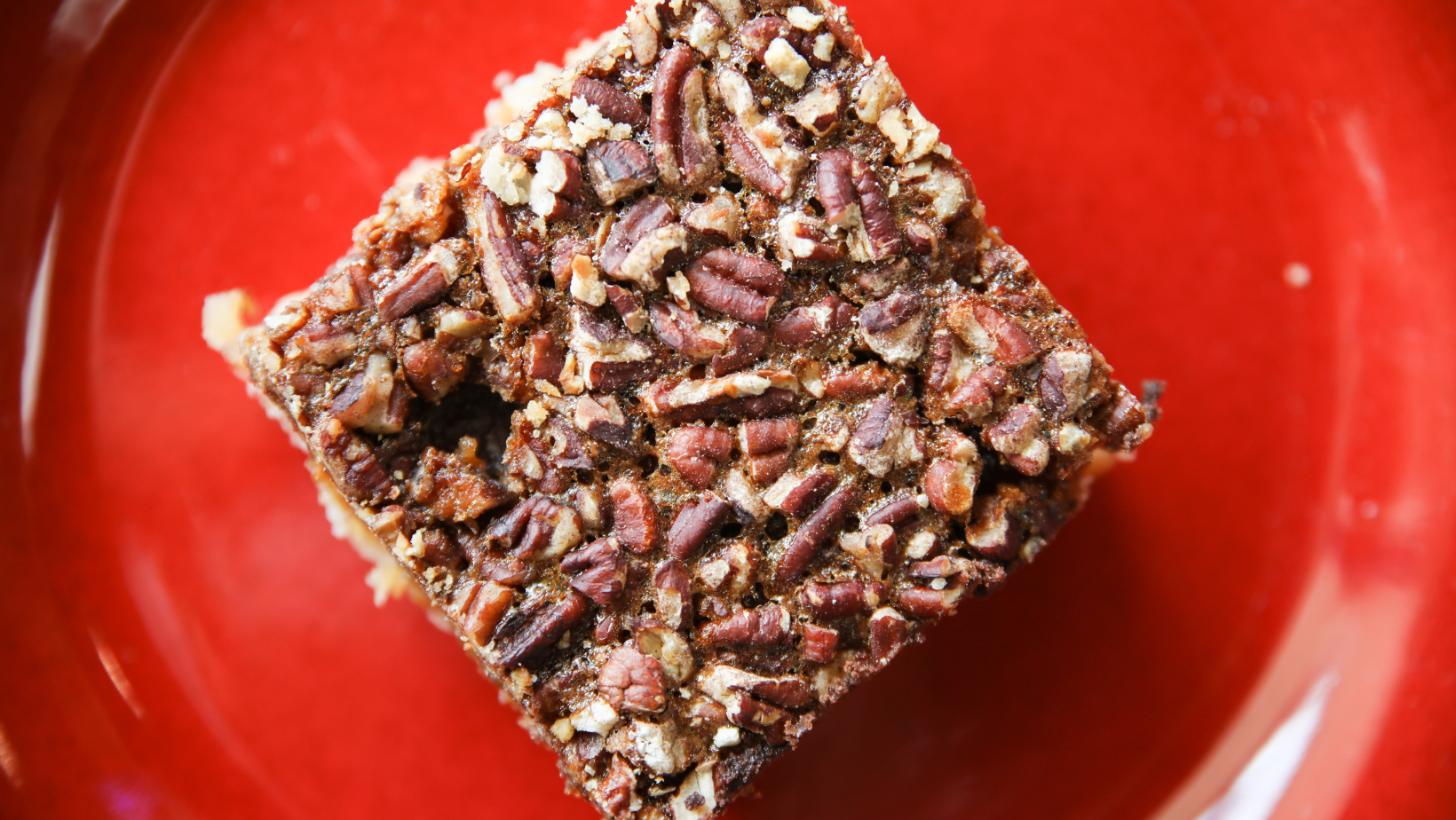 low-carb almond flour pecan pie sugar free dessert bar on a red plate