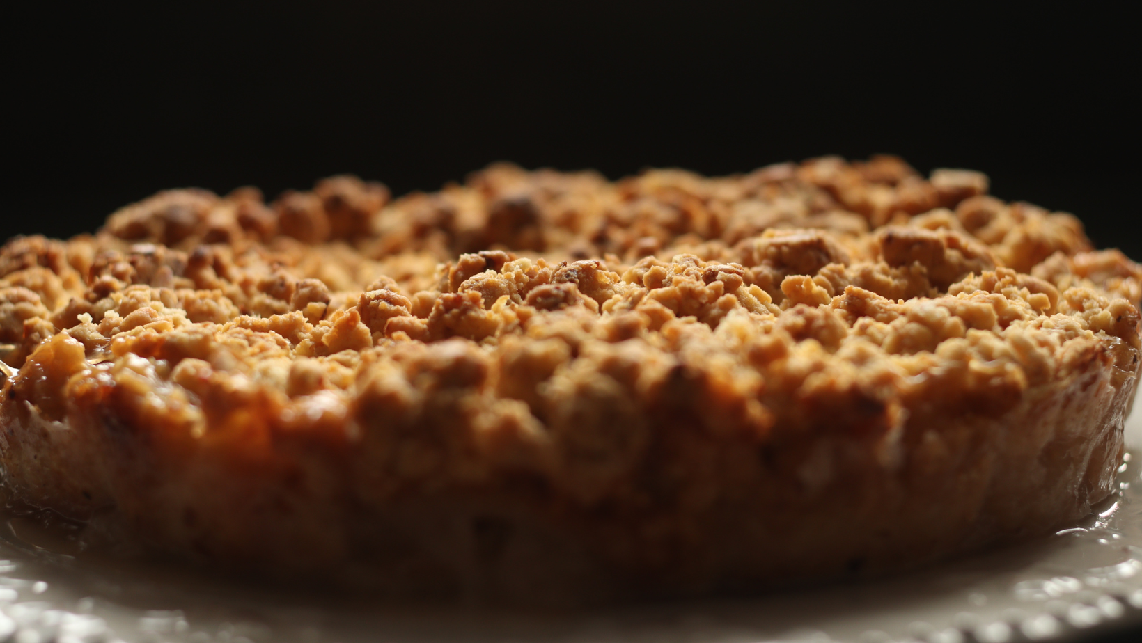 Apple, pie, tatsy. Selective focus of gluten free apple crisp pie on a dark background. Autumn concept.