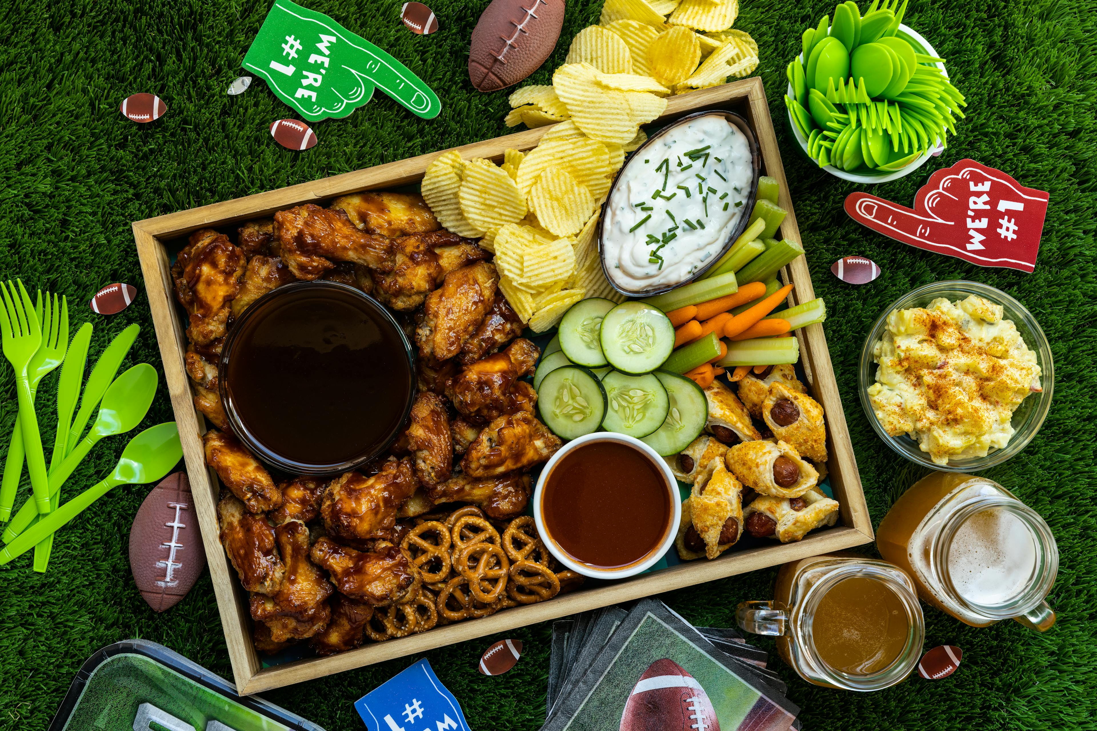 Overhead view of fun and healthy snacks and beer for fun celebrating game day with family and friends.